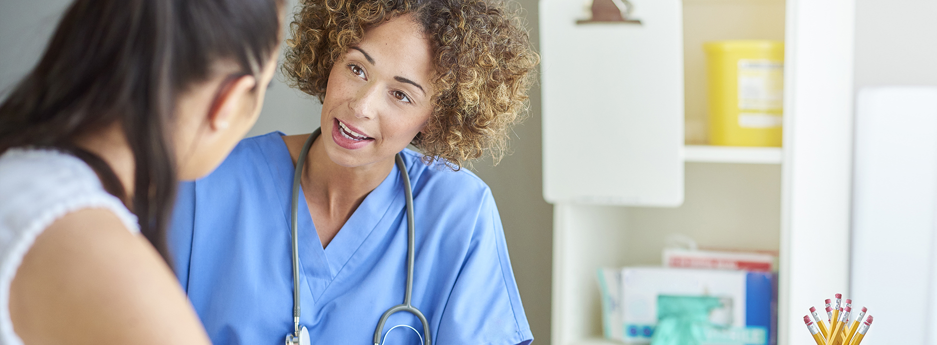 female nurse speaking to patient