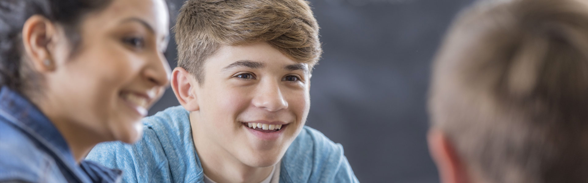 young male talking to friends